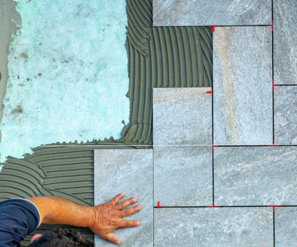 Top view of a tiler working in a garden.